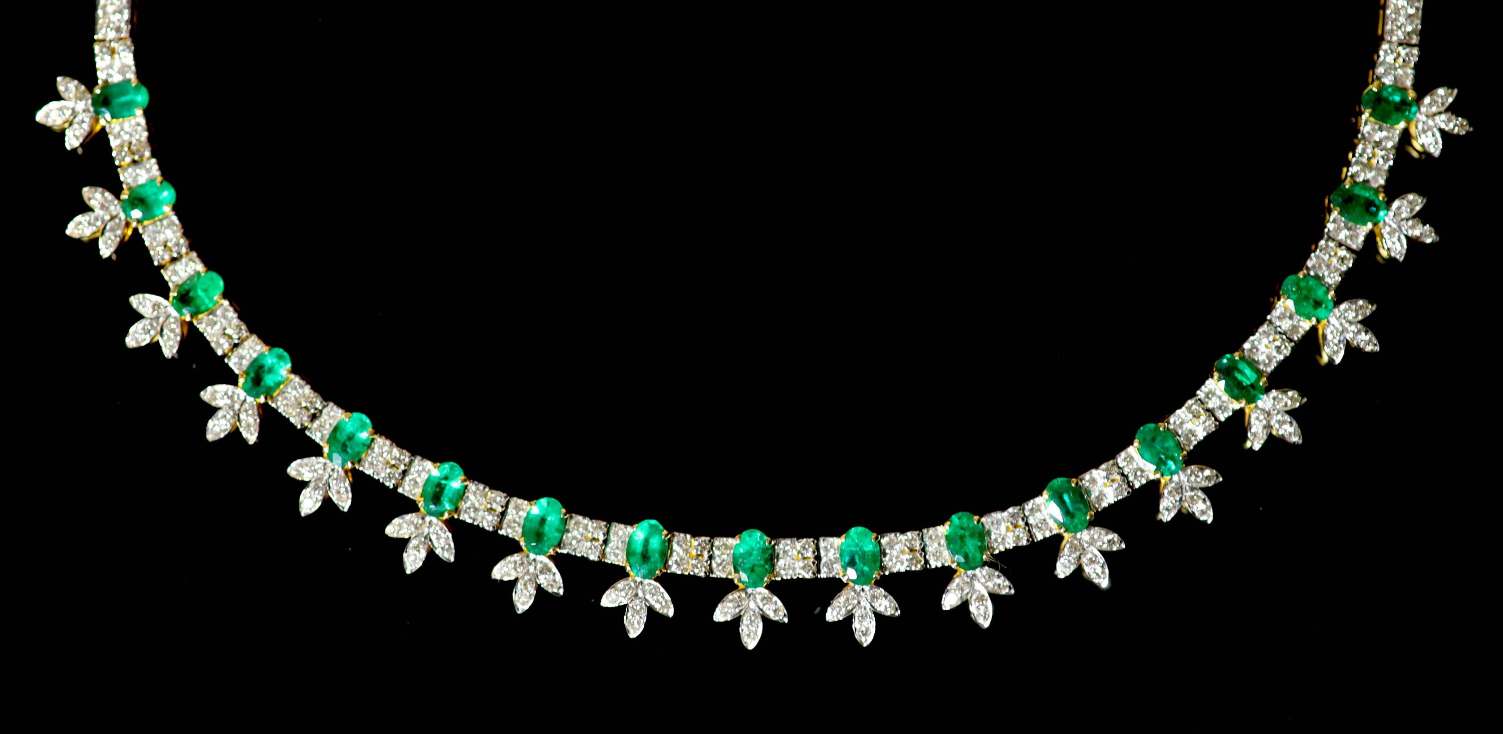 An attractive modern 18k gold, emerald and diamond cluster set choker necklace,